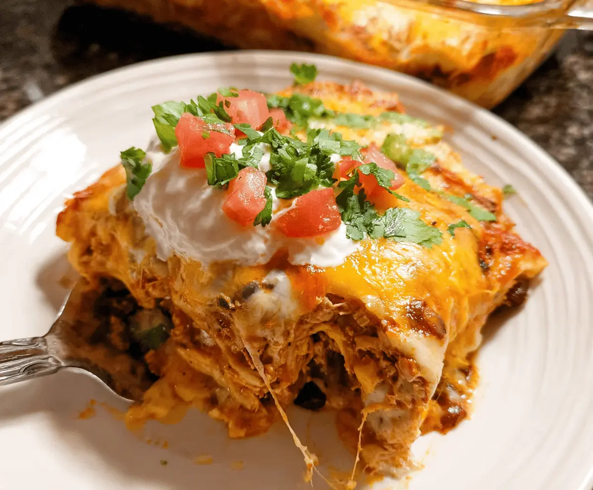 Delicious Chicken Burrito Casserole topped with melted cheese, fresh cilantro, and sliced jalapenos, served in a baking dish