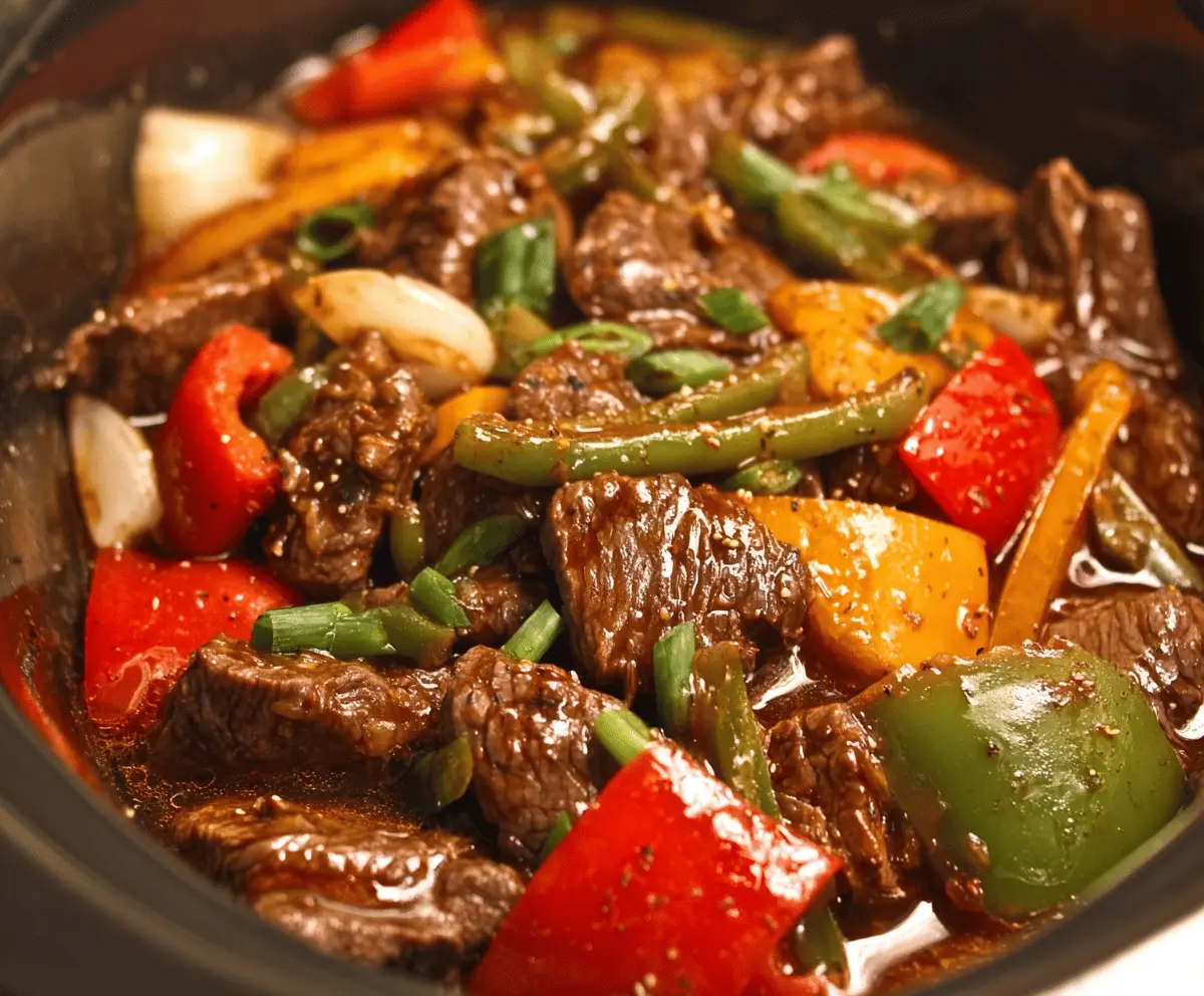 Delicious Pepper Steak cooked in a Crock Pot, featuring tender beef strips, colorful bell peppers, and savory sauce for a hearty and flavorful meal