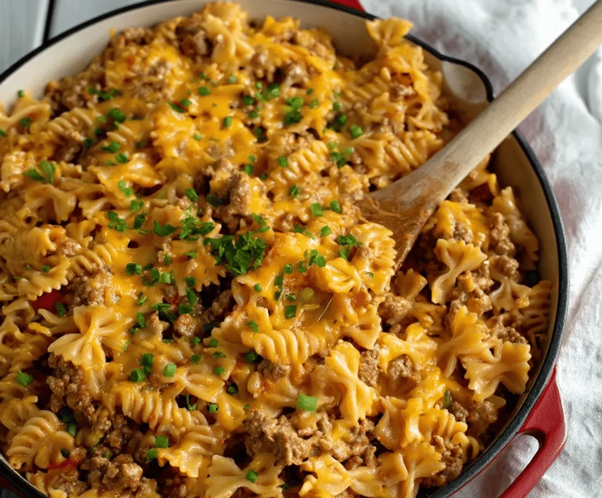 Creamy cheesy ground turkey pasta served in a bowl, highlighting a comforting and easy-to-make meal with melted cheese and cooked pasta