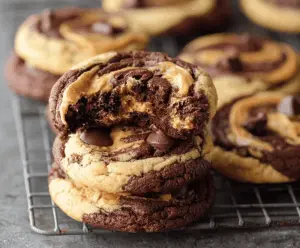Delicious peanut butter brownie swirl cookies with rich chocolate and creamy peanut butter topping, perfect for dessert or sweet snack.
