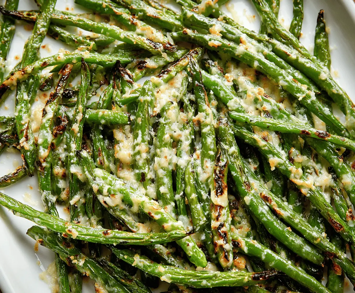 Delicious roasted green beans topped with grated Parmesan cheese, served as a savory side dish