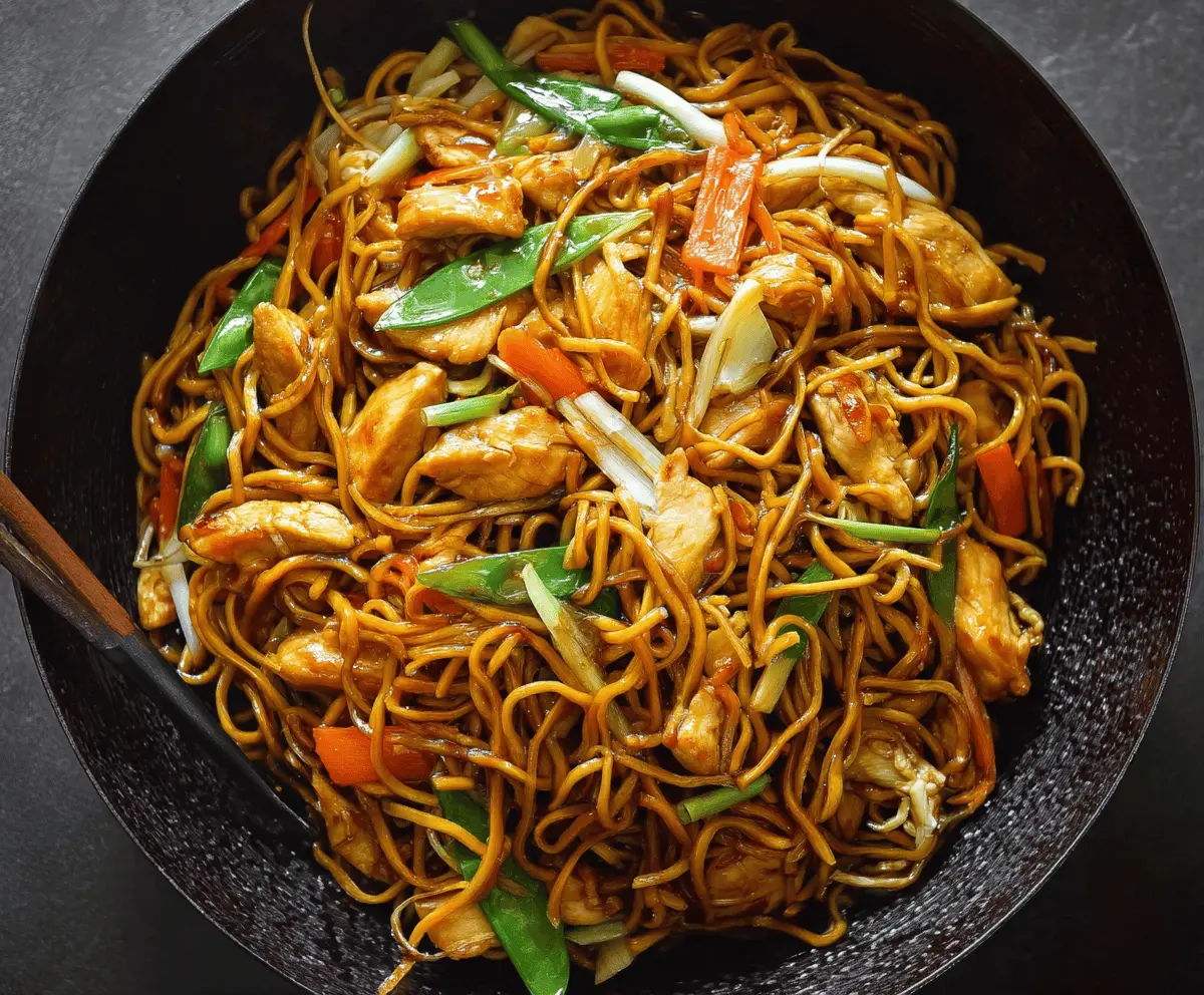 Delicious Chicken Chow Mein with stir-fried noodles, vegetables, and tender chicken strips.