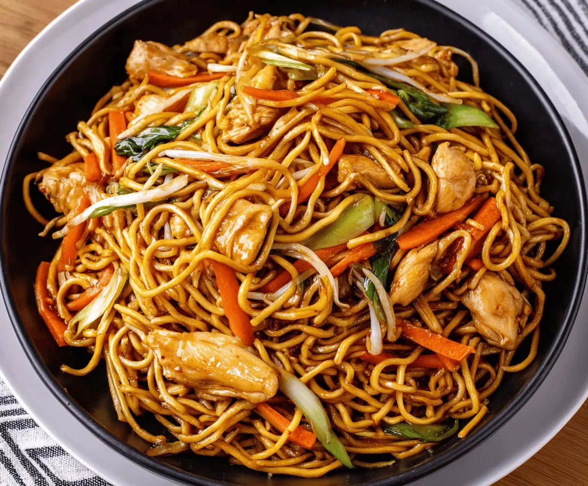 Delicious Chicken Chow Mein with stir-fried vegetables and noodles on a plate.