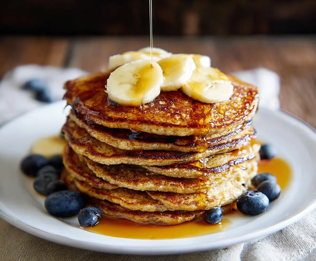 Healthy 3 ingredient banana oatmeal pancakes on a plate, perfect for a quick breakfast.
