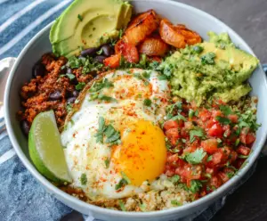 Low Carb Breakfast Burrito Bowl with scrambled eggs, avocado, and cheese in a bowl for a healthy breakfast