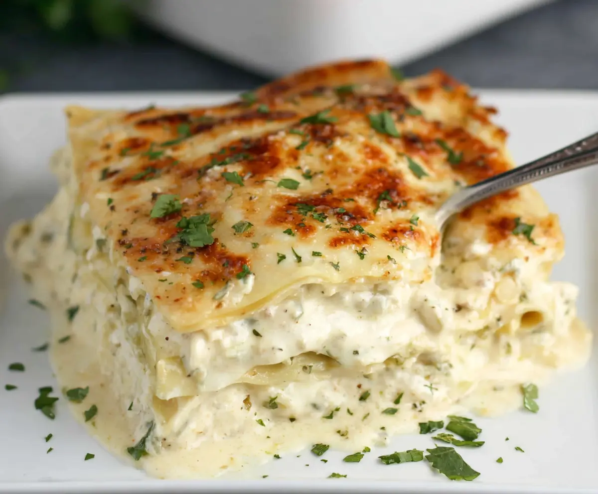 Delicious creamy white lasagna layered with cheese and tender pasta for a perfect dinner.