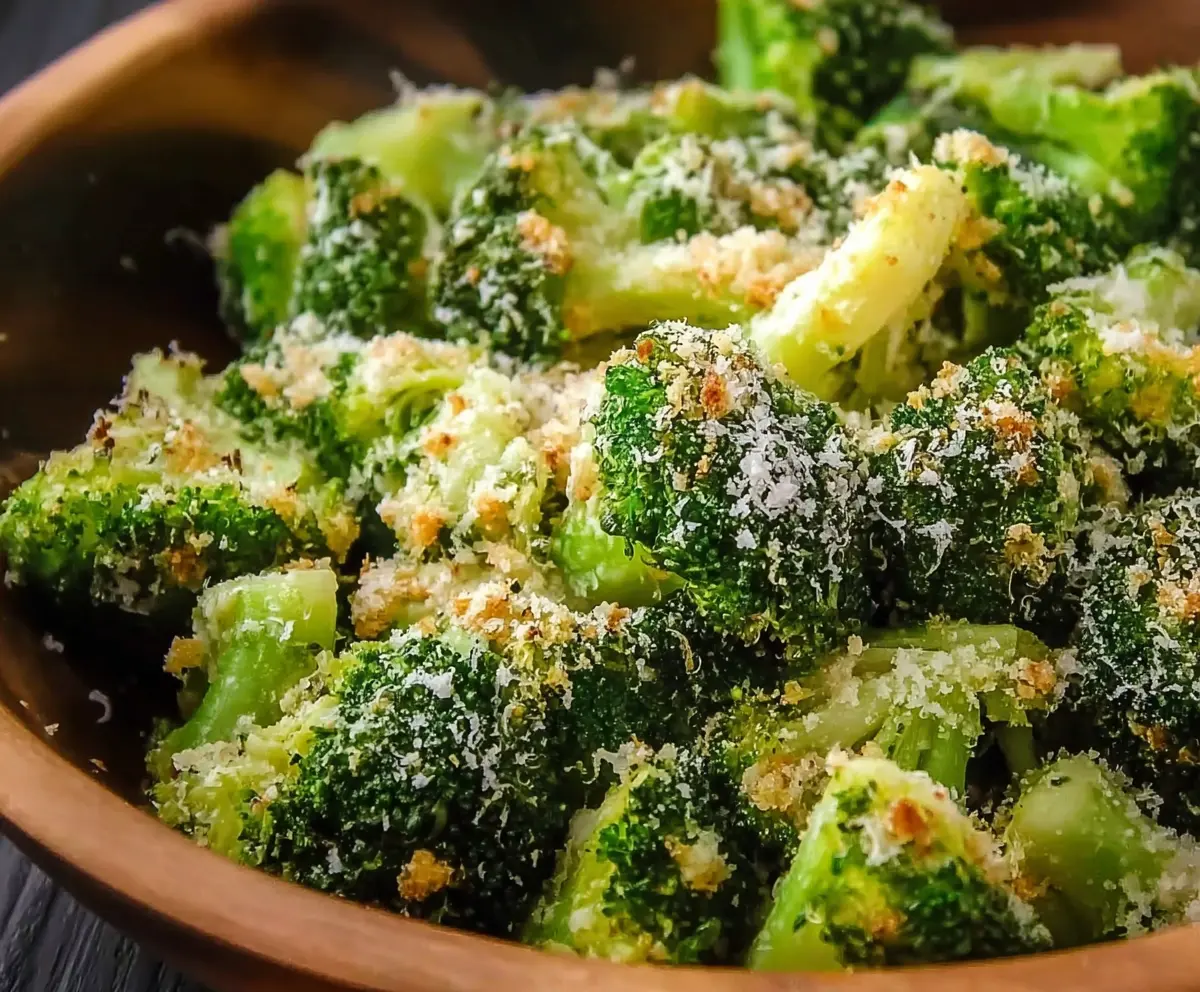 Delicious Copycat Longhorn Garlic Parmesan Broccoli served on a plate, showcasing broccoli florets coated with garlic Parmesan sauce.